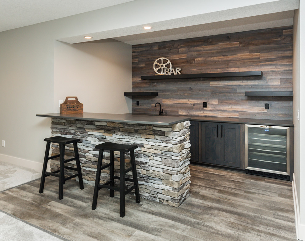 This is an example of a modern u-shaped wet bar in Other with carpet, grey floor, an undermount sink, shaker cabinets, dark wood cabinets, quartz benchtops, timber splashback and grey benchtop.