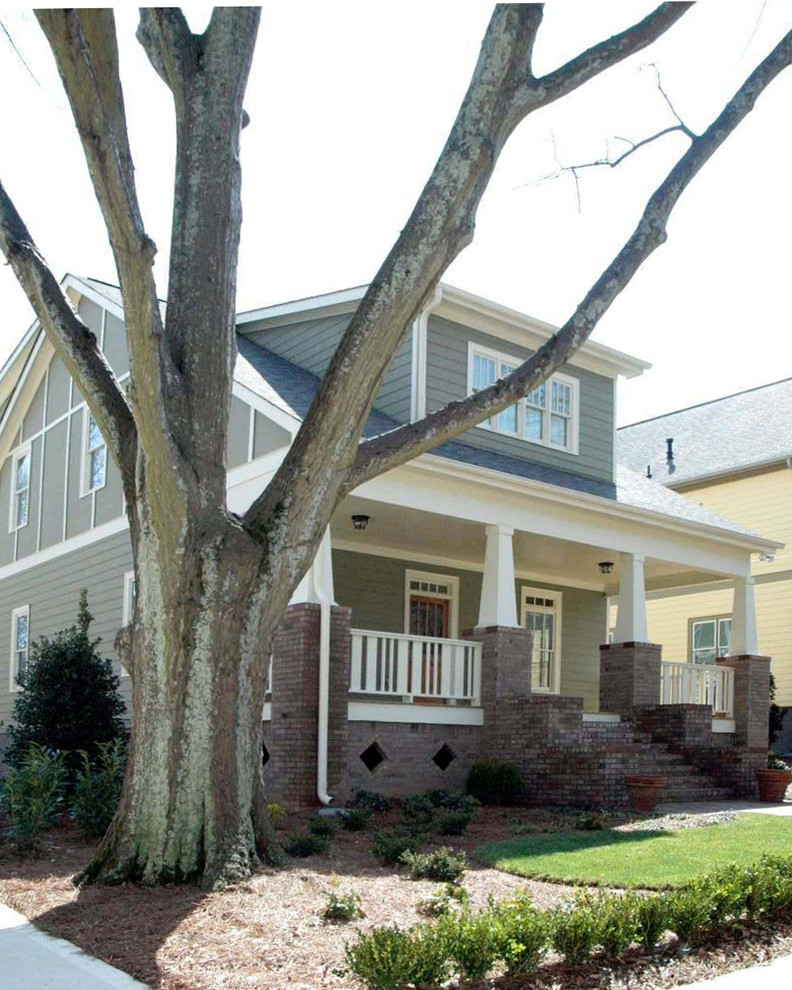 Inspiration for a mid-sized arts and crafts three-storey grey house exterior in Atlanta with concrete fiberboard siding, a gable roof and a shingle roof.