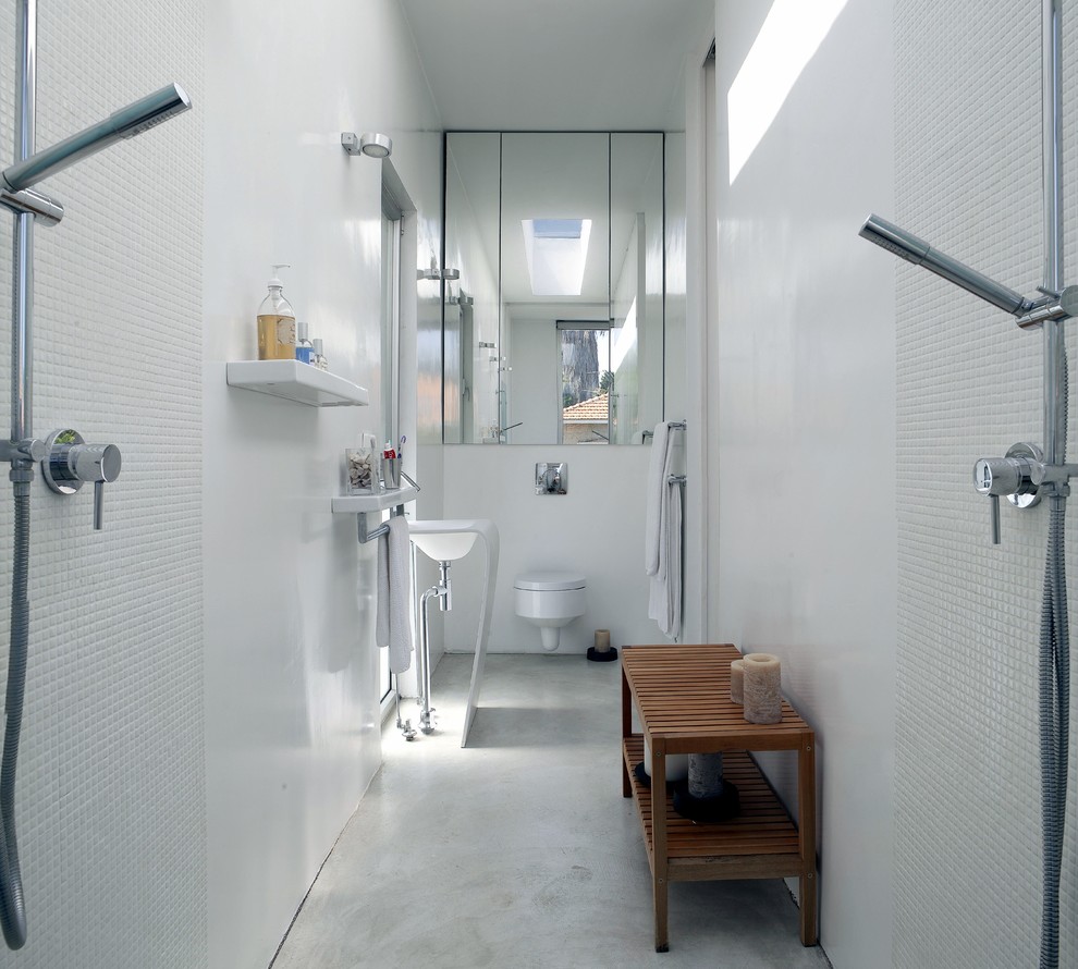 Photo of a modern bathroom in Tel Aviv with an open shower, a wall-mount toilet, white tile, mosaic tile and an open shower.