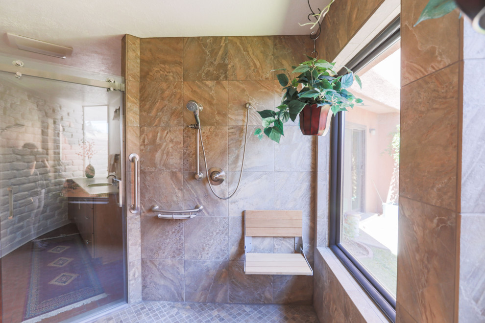 This is an example of an expansive transitional master wet room bathroom in Albuquerque with shaker cabinets, medium wood cabinets, white walls, brick floors, solid surface benchtops, red floor, a sliding shower screen, beige benchtops, a shower seat, a single vanity and a built-in vanity.