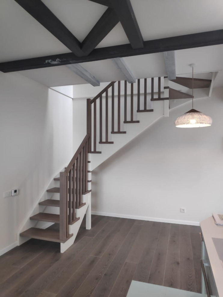 Inspiration for a small wooden l-shaped wood railing and brick wall staircase remodel in Moscow