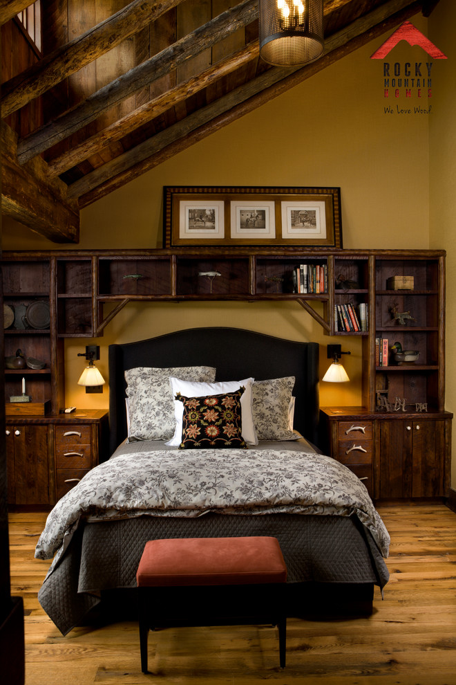 This is an example of a mid-sized country bedroom in Other with yellow walls and light hardwood floors.