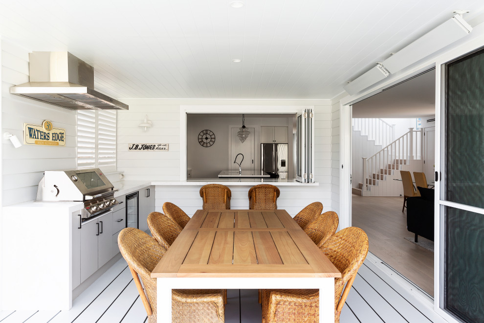 This is an example of a large beach style deck in Sydney.