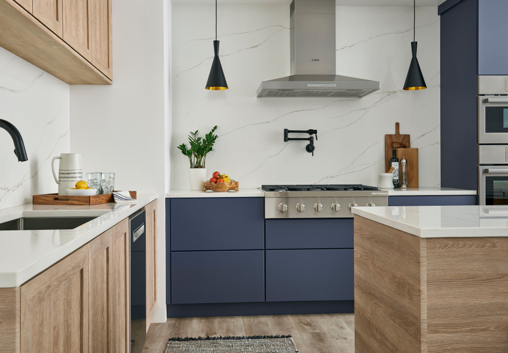 Danish l-shaped beige floor eat-in kitchen photo in Minneapolis with a drop-in sink, shaker cabinets, blue cabinets, white backsplash, stone slab backsplash, stainless steel appliances, an island and white countertops