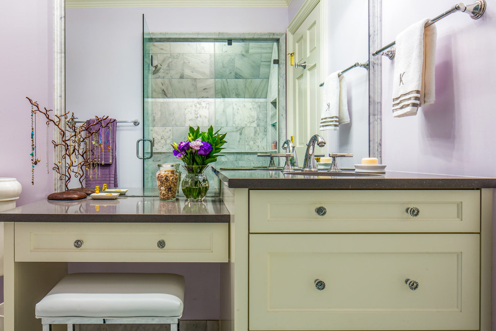 Photo of a mid-sized transitional bathroom in Austin with recessed-panel cabinets, white cabinets, purple walls, marble floors, an undermount sink, solid surface benchtops and with a sauna.