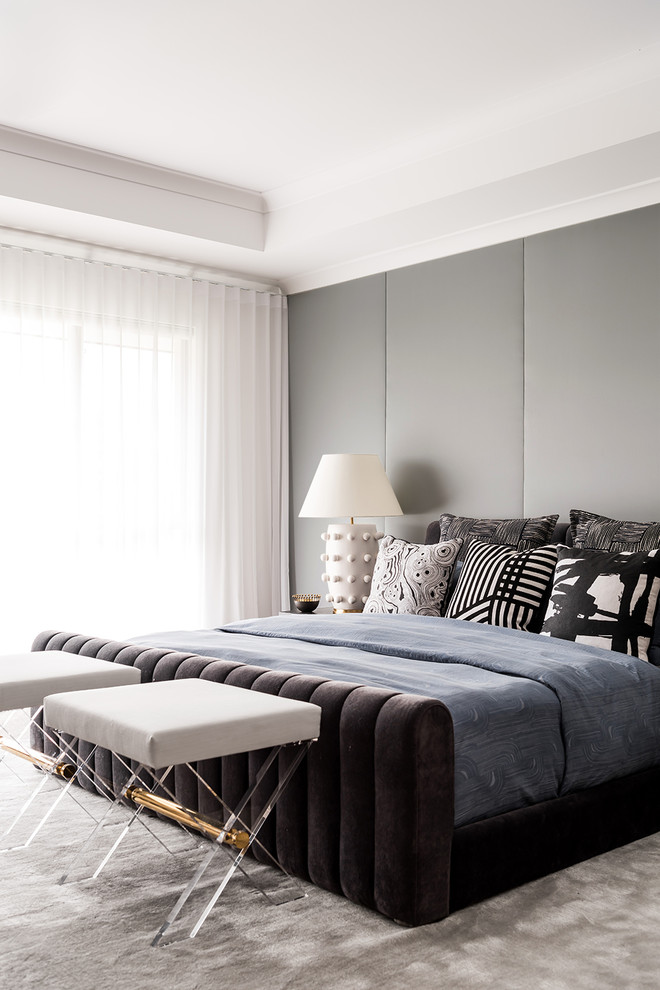 This is an example of a large contemporary master bedroom in Melbourne with grey walls, carpet and grey floor.