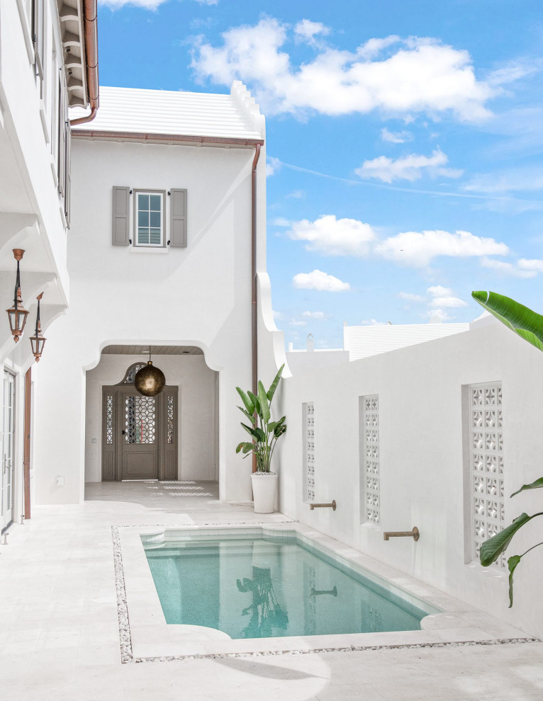 Inspiration for a mediterranean tile and custom-shaped pool fountain remodel in Other