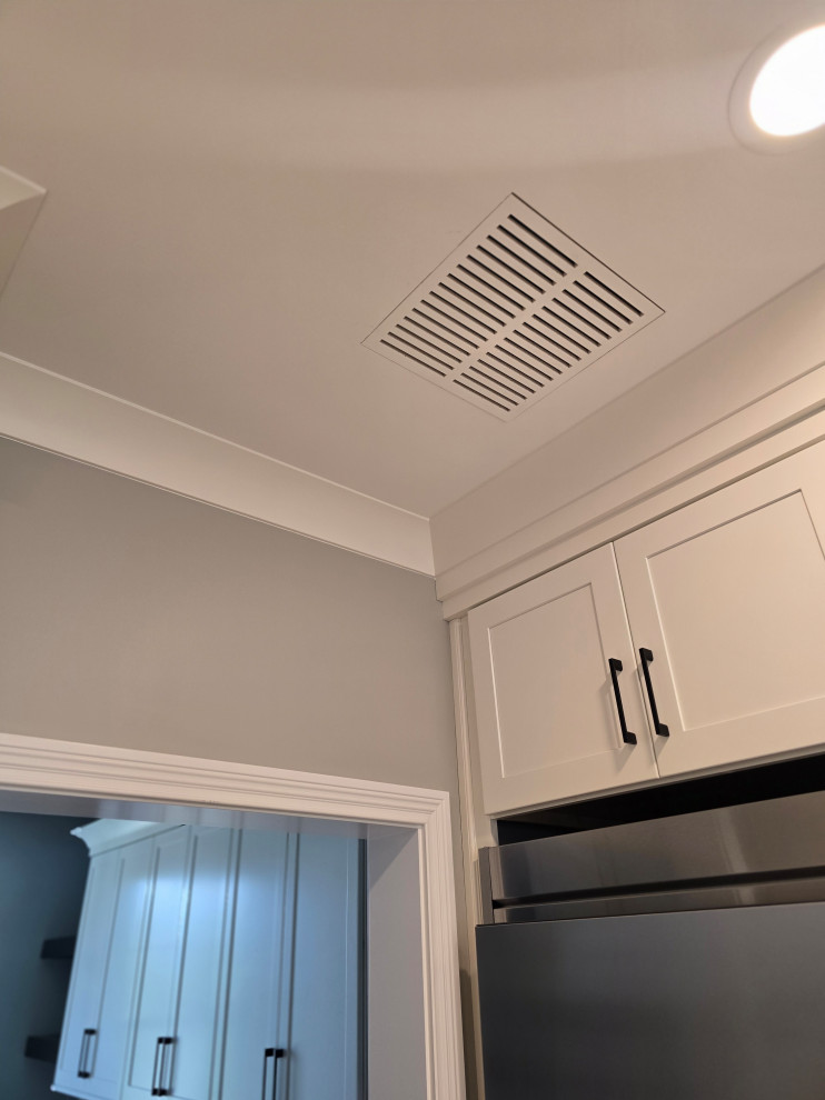 Inspiration for a large modern kitchen remodel with shaker cabinets and white cabinets