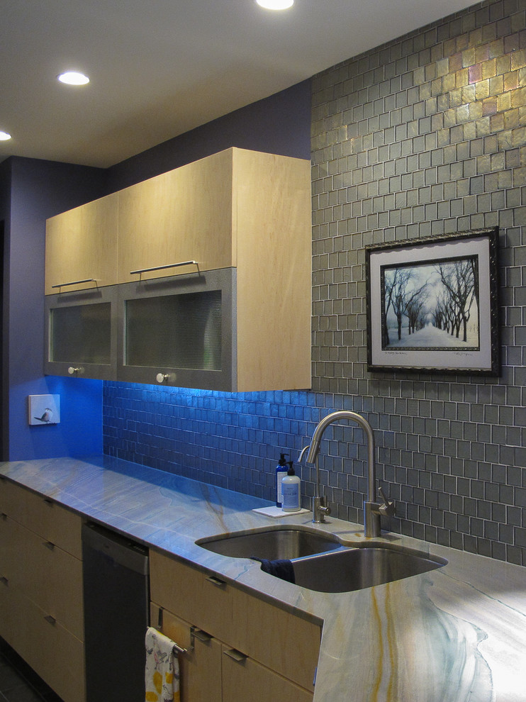 Inspiration for a ceramic tile kitchen remodel with flat-panel cabinets, light wood cabinets and stainless steel appliances