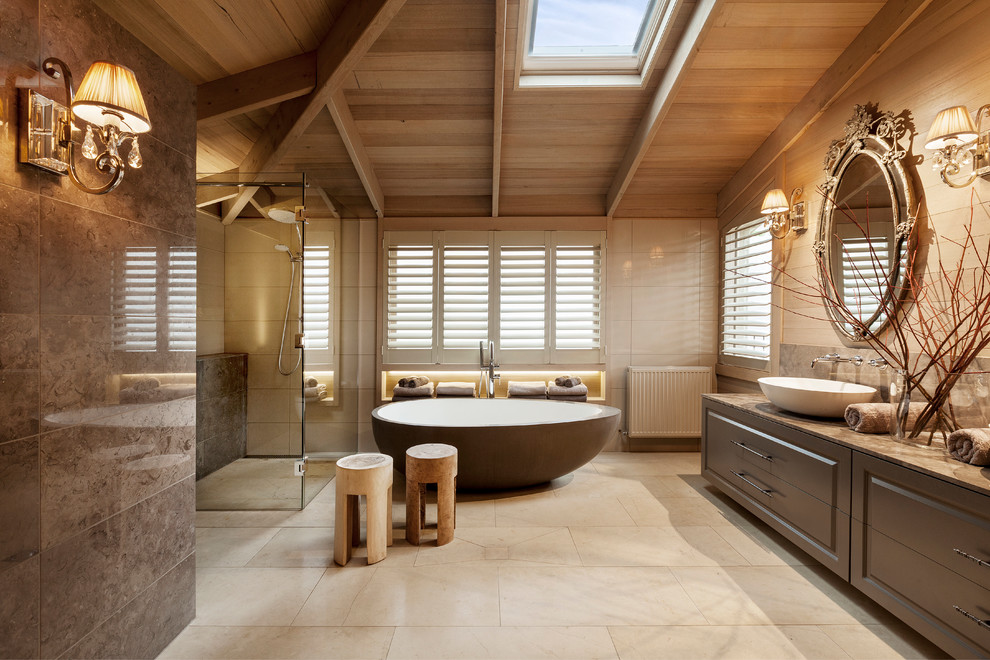 Design ideas for a large transitional master bathroom in Melbourne with a vessel sink, raised-panel cabinets, a freestanding tub, a curbless shower and beige tile.