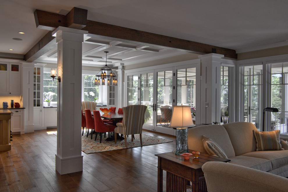 Large country dining room in Minneapolis with white walls, medium hardwood floors, no fireplace, brown floor, coffered and planked wall panelling.