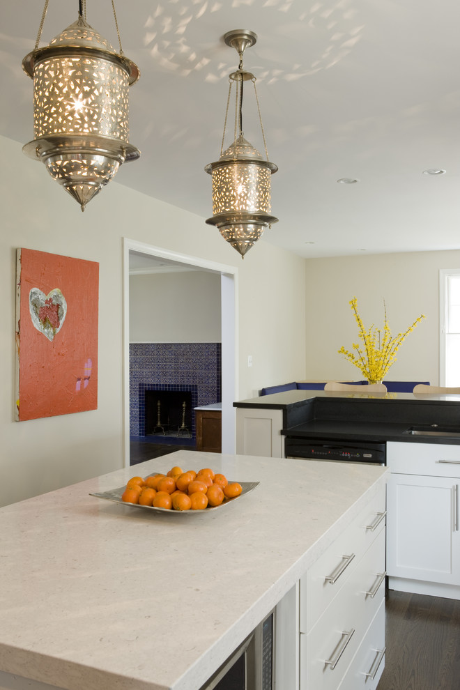 Eclectic dark wood floor eat-in kitchen photo in DC Metro with white cabinets, white backsplash, subway tile backsplash, stainless steel appliances and an island