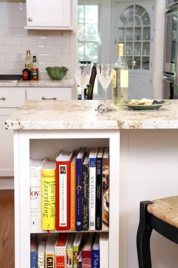Inspiration for a mid-sized transitional l-shaped dark wood floor eat-in kitchen remodel in Cedar Rapids with a farmhouse sink, shaker cabinets, white cabinets, granite countertops, white backsplash, subway tile backsplash, stainless steel appliances and an island
