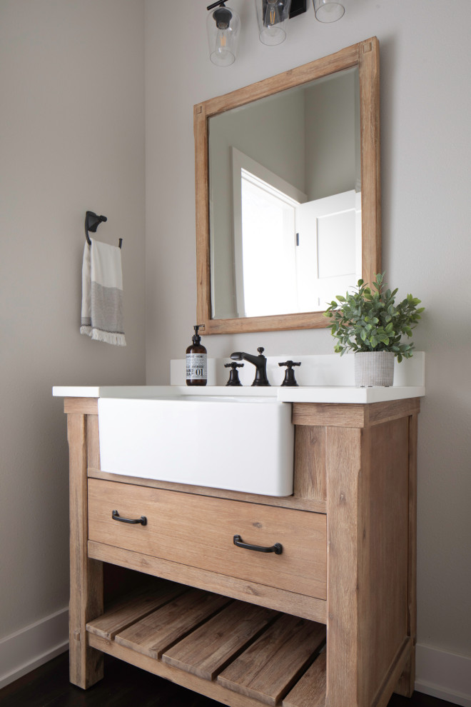 Design ideas for a mid-sized powder room in Milwaukee with furniture-like cabinets, beige cabinets, grey walls, dark hardwood floors, a drop-in sink, engineered quartz benchtops, brown floor, white benchtops and a freestanding vanity.