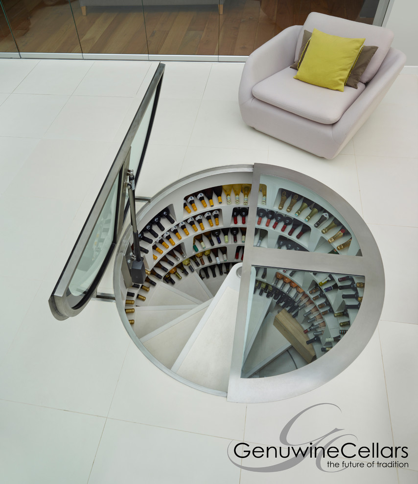 Inspiration for a mid-sized contemporary wine cellar in New York with concrete floors and storage racks.