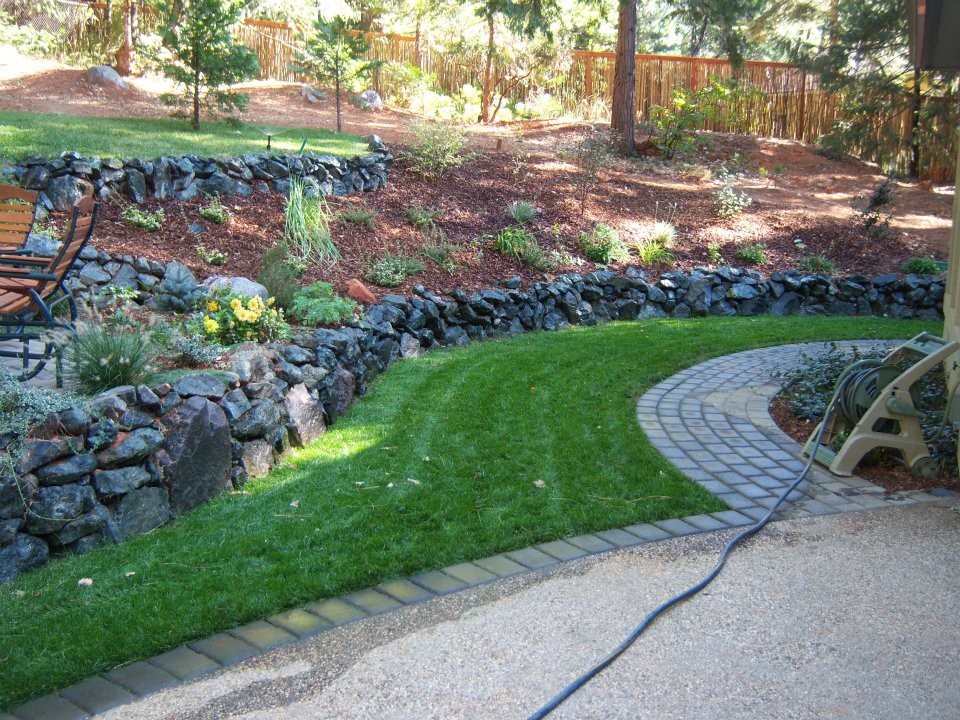 Photo of a backyard stone retaining wall landscape in Sacramento.