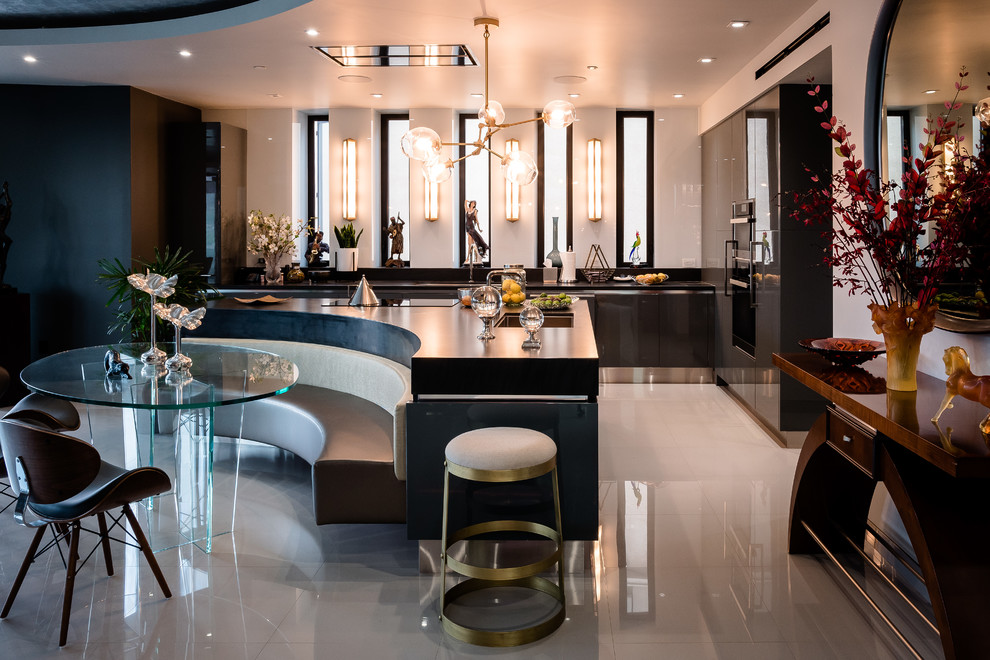 Expansive contemporary u-shaped wet bar in Los Angeles with an undermount sink, flat-panel cabinets, grey cabinets, marble benchtops, grey splashback, stone slab splashback, porcelain floors, white floor and white benchtop.