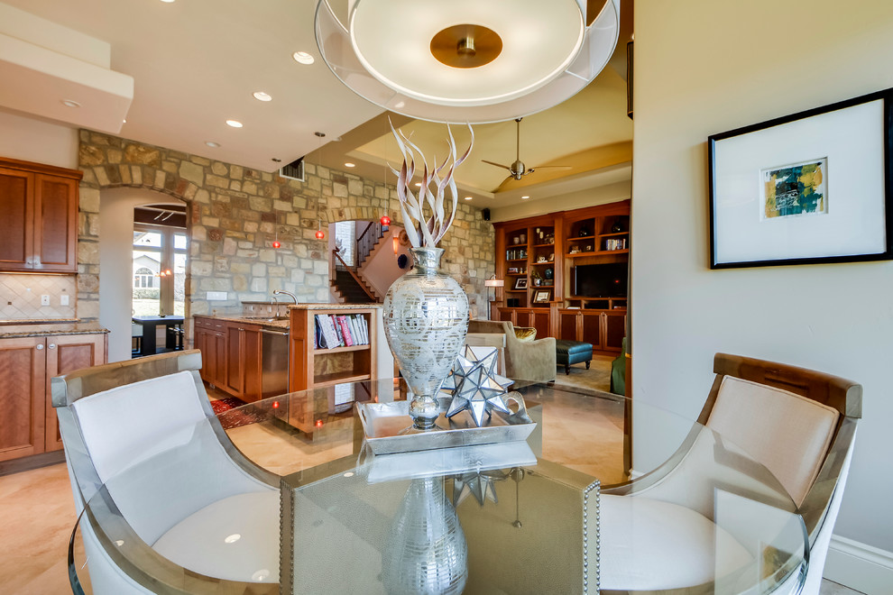 Example of a mid-sized transitional l-shaped travertine floor open concept kitchen design in Austin with an undermount sink, shaker cabinets, medium tone wood cabinets, granite countertops, beige backsplash, stone tile backsplash, stainless steel appliances and an island