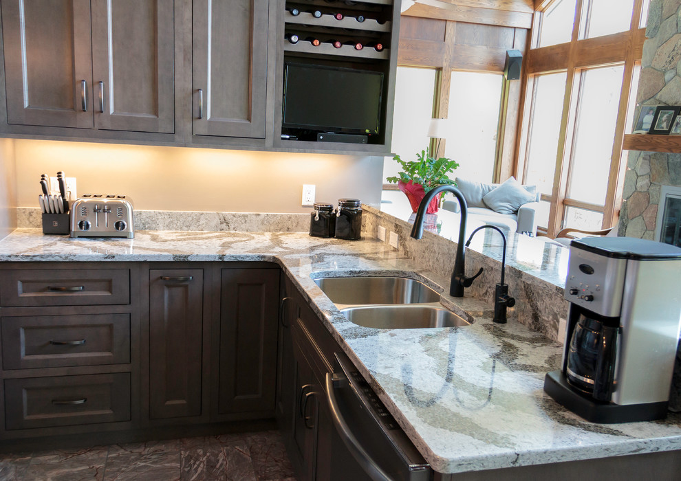 Large transitional u-shaped marble floor eat-in kitchen photo with an undermount sink, flat-panel cabinets, quartz countertops, stainless steel appliances and an island