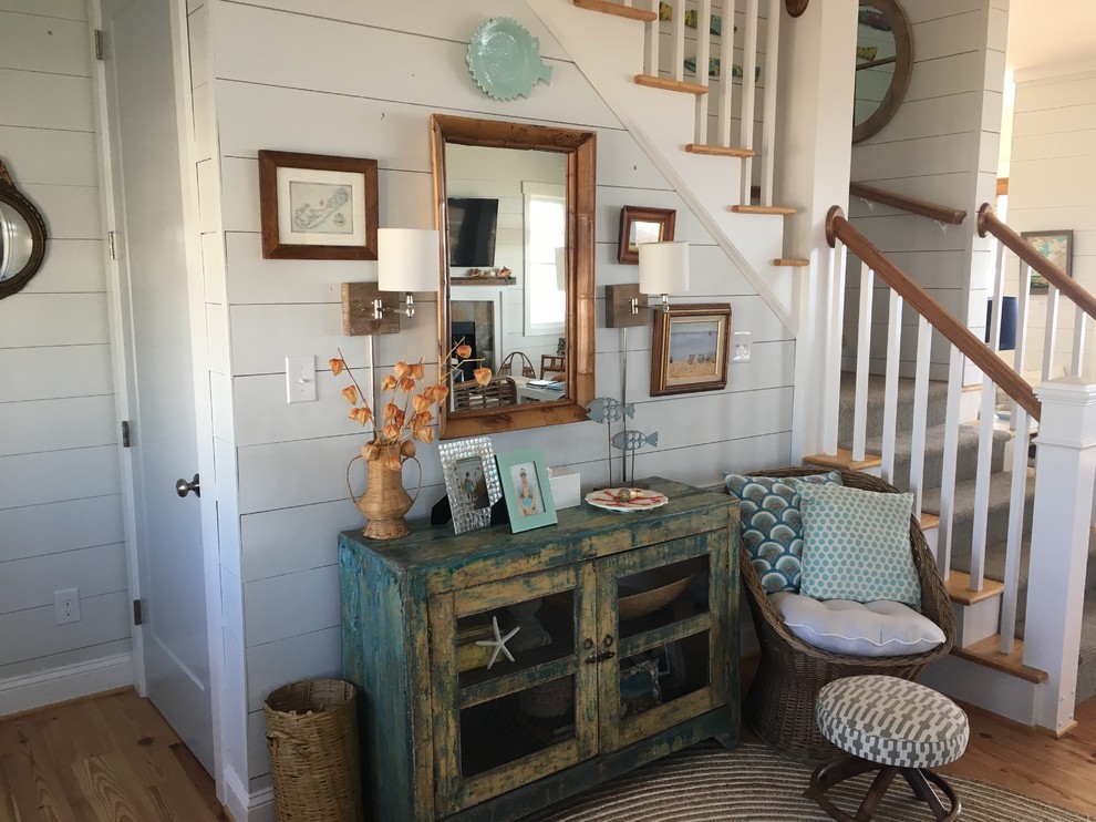 Photo of a beach style foyer in Other with medium hardwood floors.