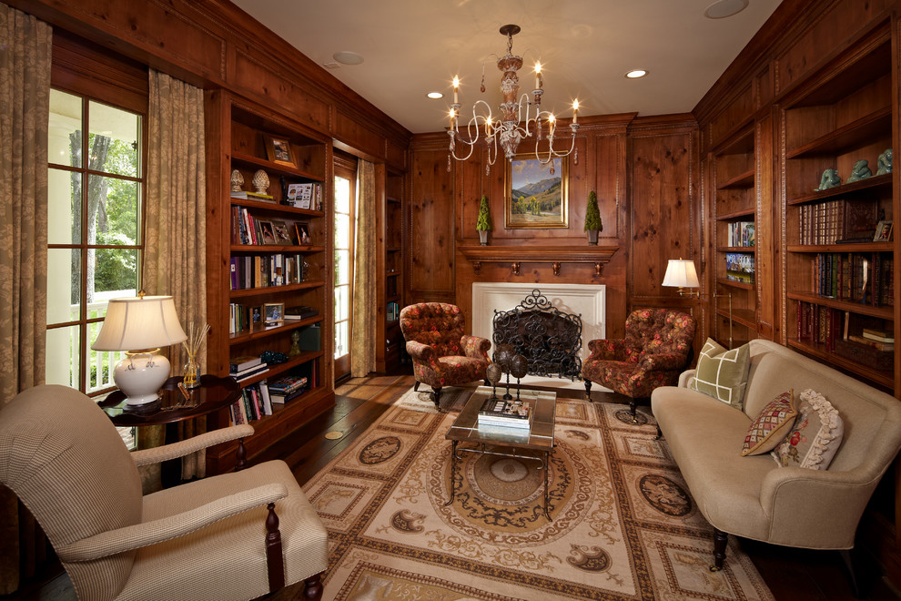 This is an example of a traditional home office in Houston with dark hardwood floors.