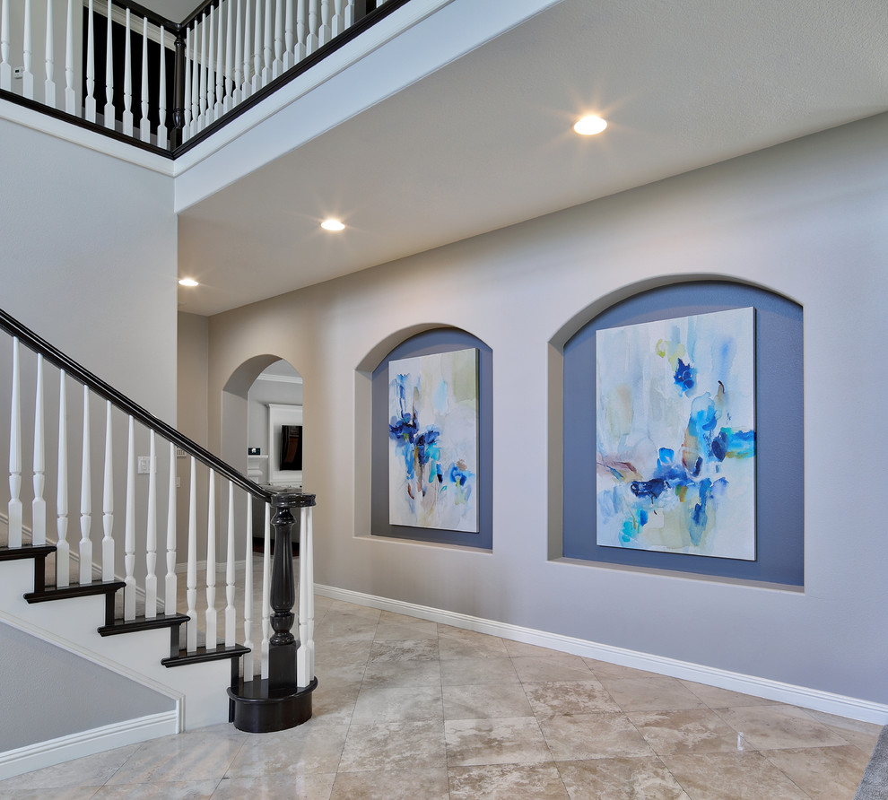 Large transitional ceramic tile and beige floor hallway photo in Orange County with gray walls