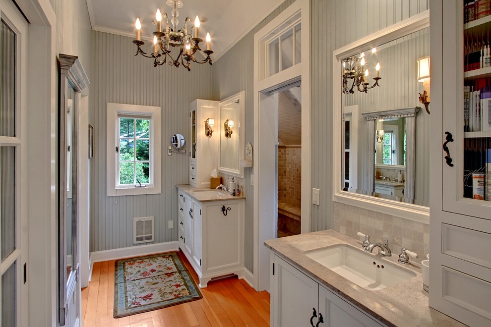 Design ideas for a large country bathroom in Seattle with recessed-panel cabinets and white cabinets.