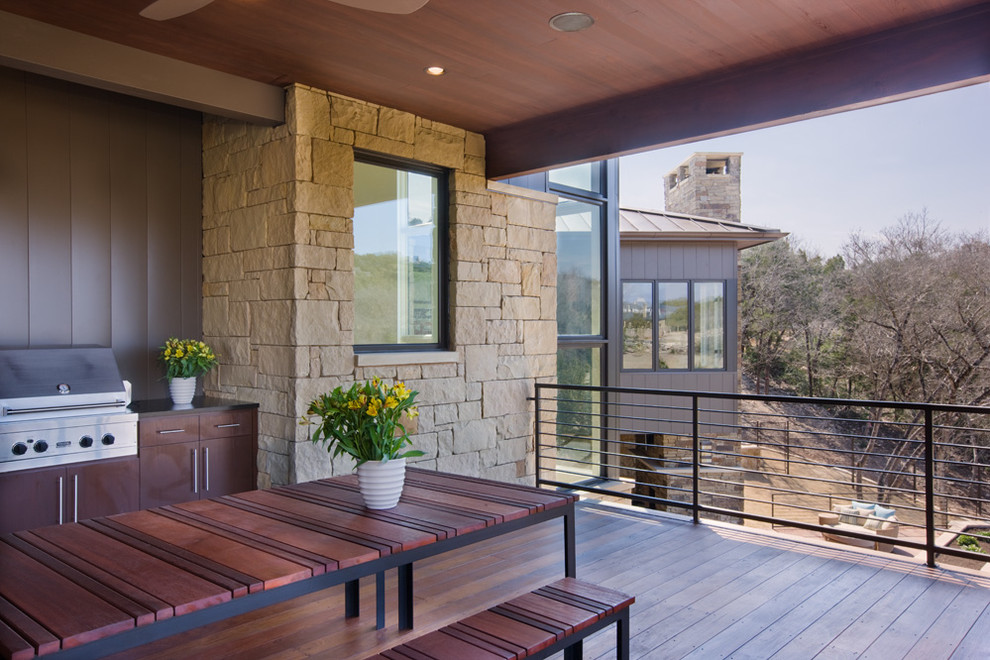 Design ideas for a contemporary patio in Austin with an outdoor kitchen and decking.
