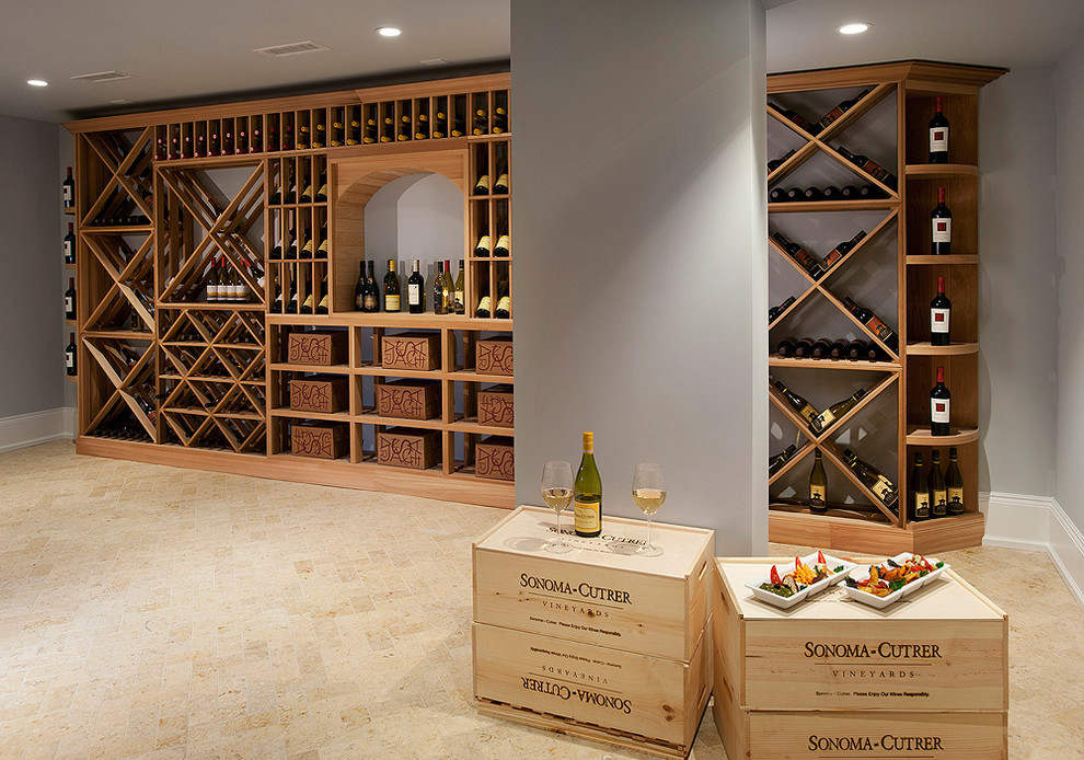 Inspiration for a large wine cellar in Philadelphia with limestone floors, diamond bins and beige floor.