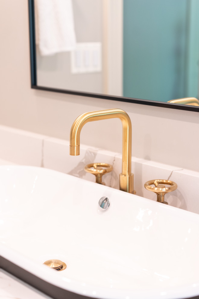 Golden Shower Head in Modern Bathroom with Tiled Walls