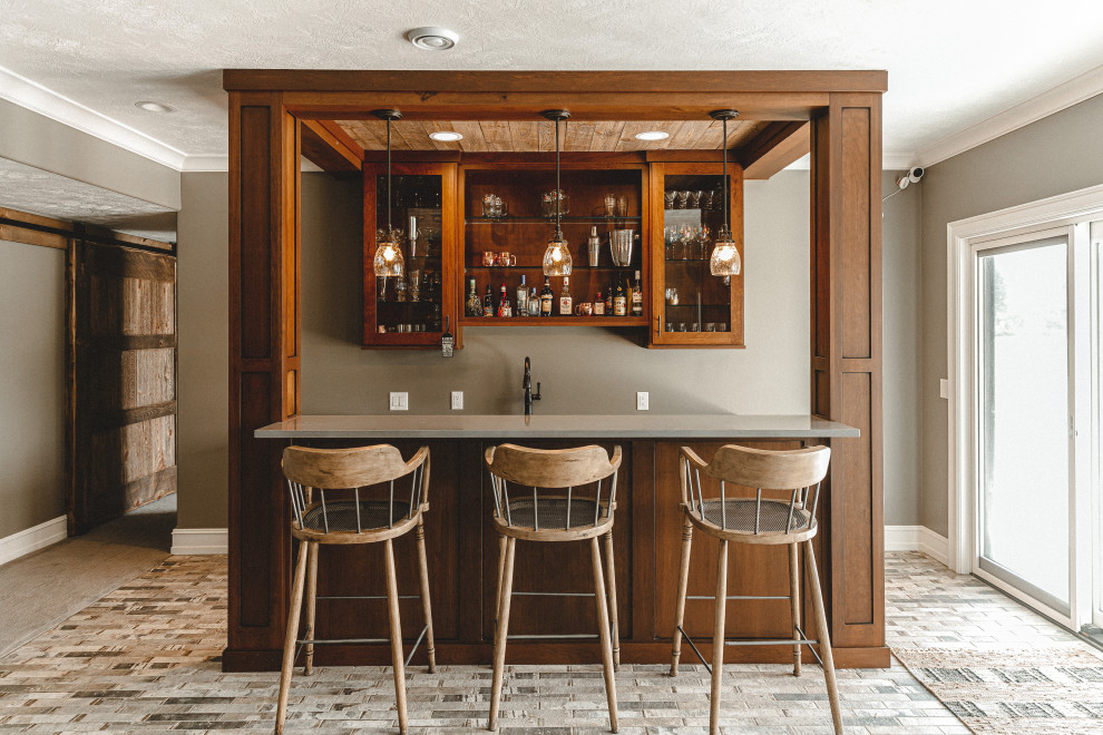 Mid-sized country galley seated home bar in Other with an undermount sink, flat-panel cabinets, medium wood cabinets, quartz benchtops, brick floors, beige floor and grey benchtop.