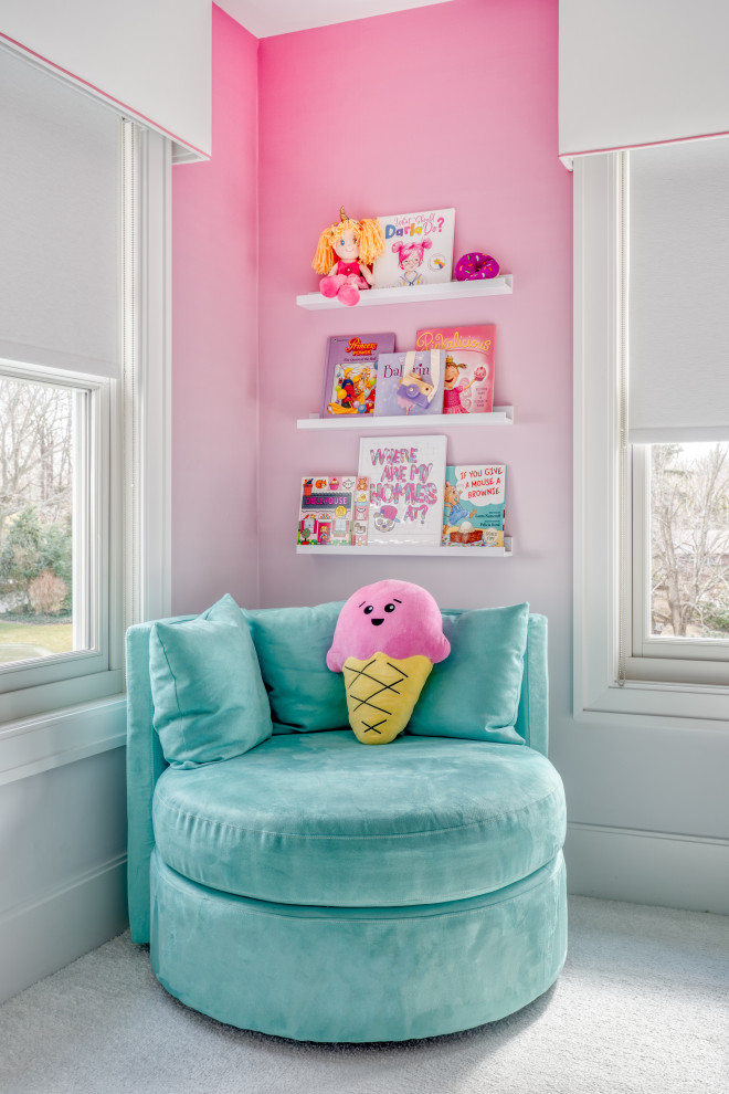 This is an example of a mid-sized modern kids' bedroom for girls in New York with pink walls, carpet and white floor.