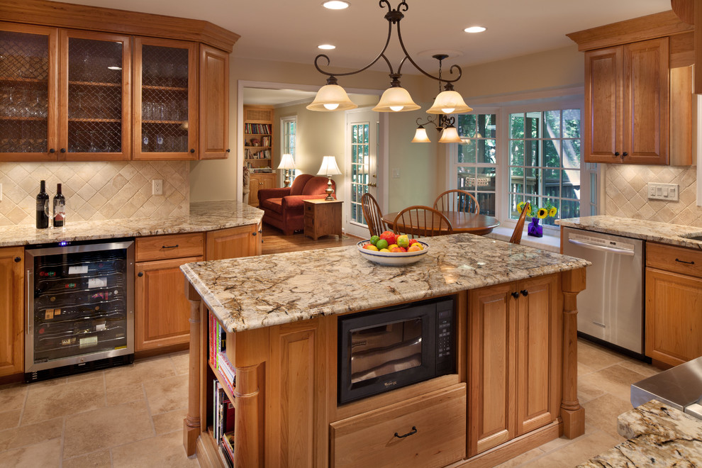 Large transitional u-shaped eat-in kitchen in DC Metro with raised-panel cabinets, medium wood cabinets, granite benchtops, beige splashback, stone tile splashback, stainless steel appliances, travertine floors, an undermount sink and with island.