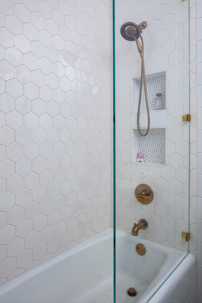 Example of a mid-sized transitional kids' white tile and ceramic tile ceramic tile and multicolored floor alcove bathtub design in Austin with recessed-panel cabinets, white cabinets, a two-piece toilet, white walls, an undermount sink, marble countertops and white countertops