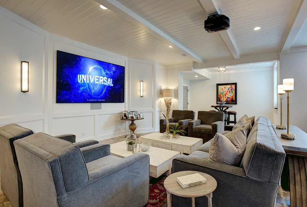 Photo of an expansive beach style open concept home theatre in Kansas City with ceramic floors, a projector screen and white walls.