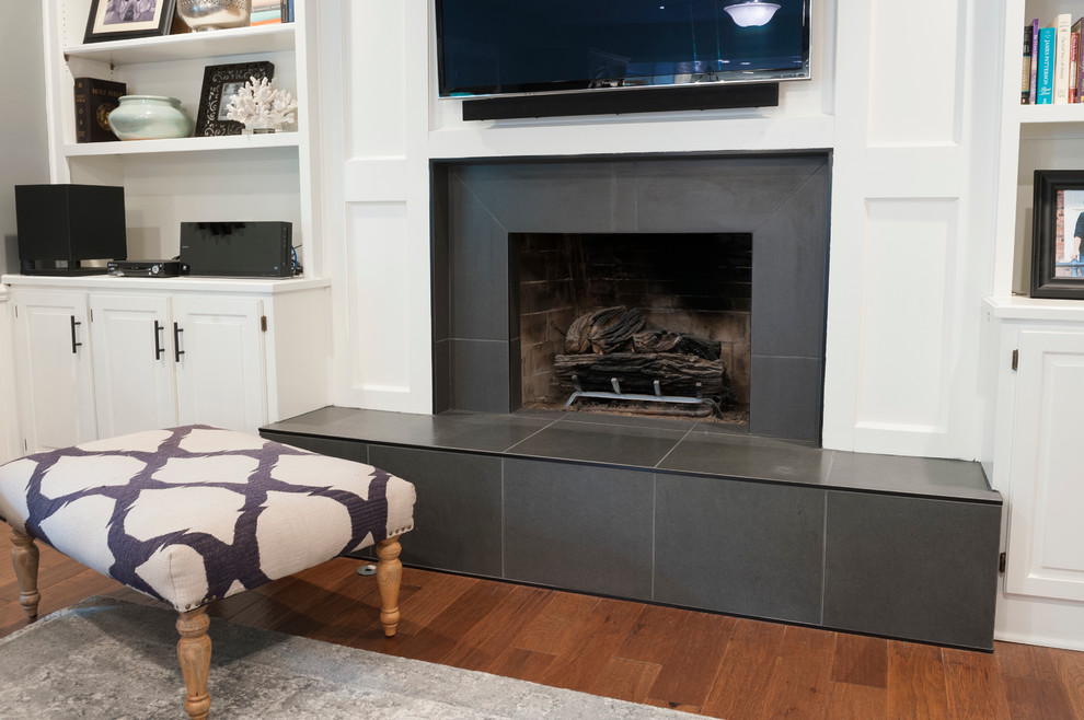 Mid-sized transitional formal enclosed living room in Indianapolis with grey walls, dark hardwood floors, a standard fireplace, a tile fireplace surround and a wall-mounted tv.