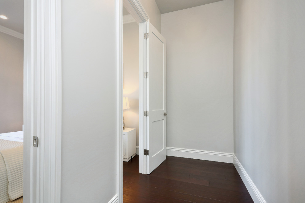 Inspiration for a large contemporary hallway in San Francisco with grey walls and dark hardwood floors.