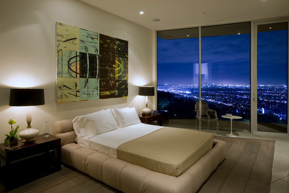 Photo of a contemporary bedroom in Los Angeles with white walls.