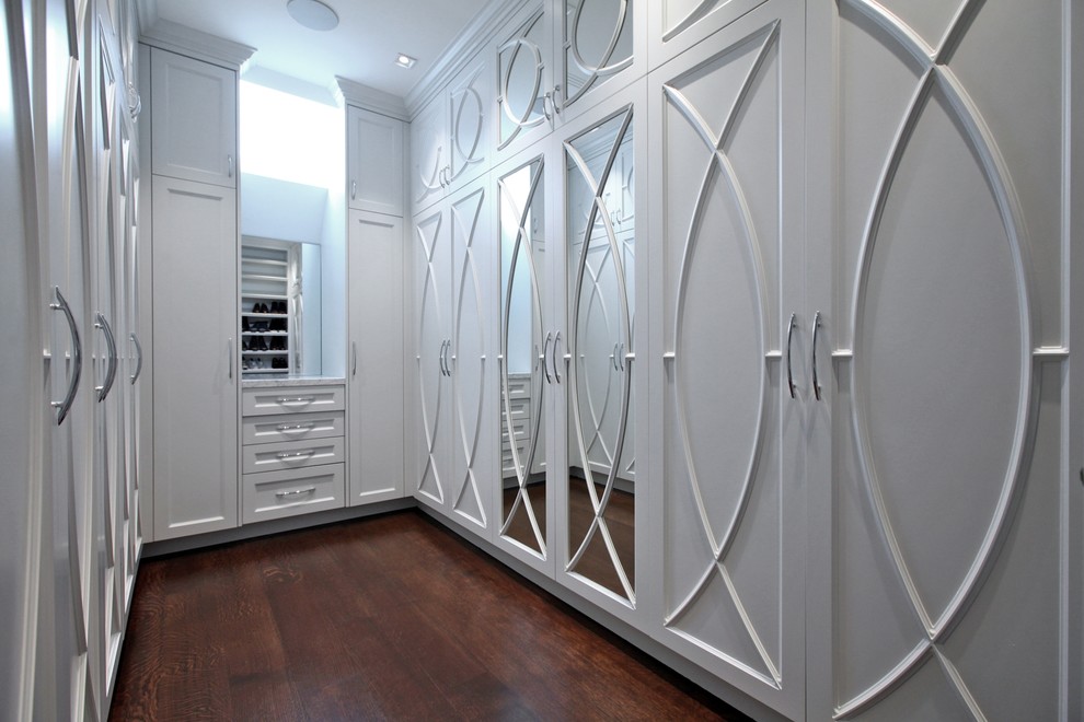 Large contemporary gender-neutral walk-in wardrobe in Toronto with recessed-panel cabinets, white cabinets, dark hardwood floors and brown floor.