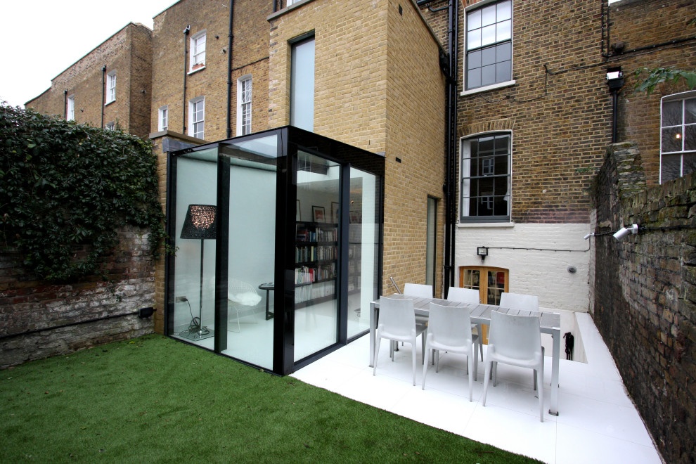 Small traditional backyard patio in London.