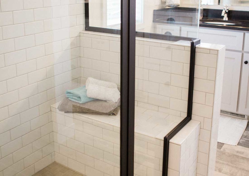 Example of a large transitional master bathroom design with shaker cabinets, white cabinets and quartzite countertops