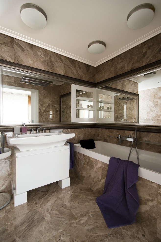 Photo of a contemporary master bathroom in Other with brown tile and an integrated sink.