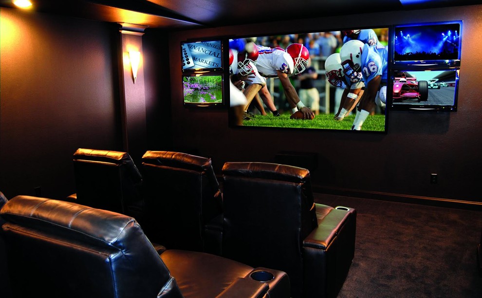 This is an example of a mid-sized modern enclosed home theatre in Other with brown walls, carpet and a wall-mounted tv.