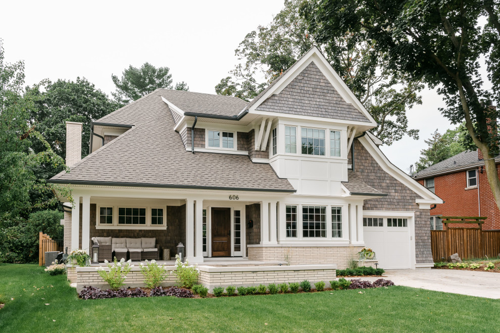 Transitional brown two-story wood and shingle house exterior photo with a shingle roof and a gray roof