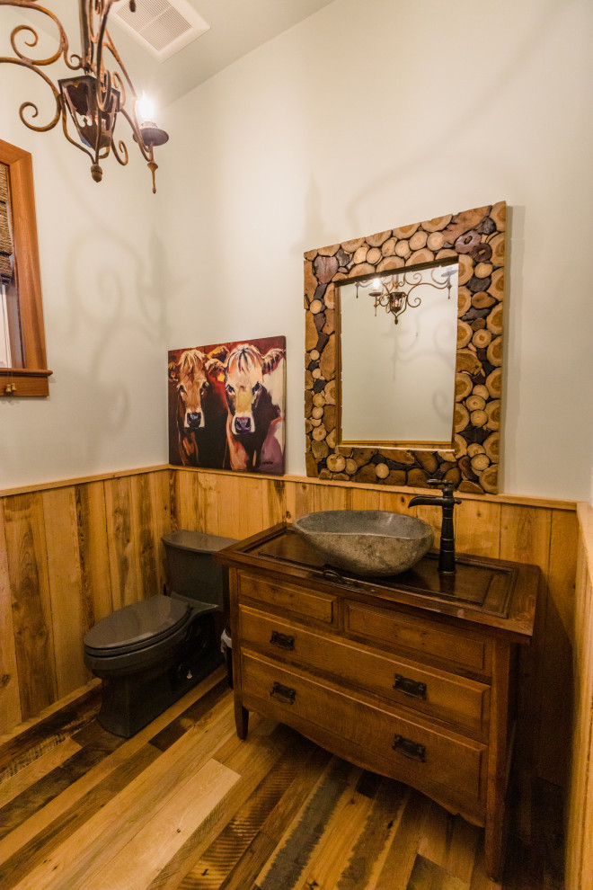 This is an example of a large rustic cloakroom in Miami with a wood ceiling and wood walls.