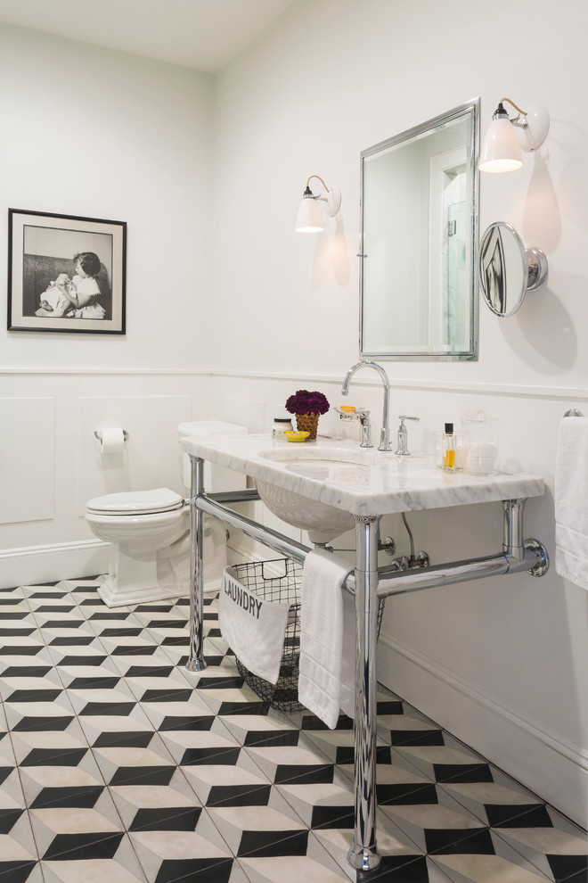 Photo of a mid-sized traditional master bathroom in New York with an undermount sink, marble benchtops, an alcove shower, a two-piece toilet, cement tile, white walls, multi-coloured floor, cement tiles and white benchtops.