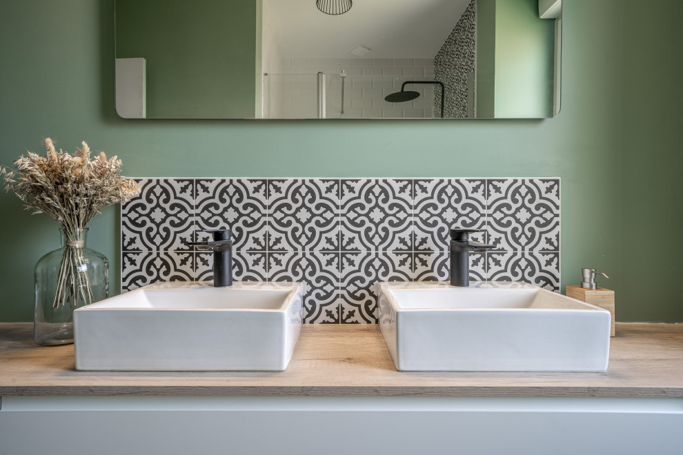 Inspiration for a medium sized mediterranean ensuite bathroom in Rennes with beaded cabinets, white cabinets, a built-in shower, black and white tiles, cement tiles, green walls, vinyl flooring, a built-in sink, wooden worktops, brown floors, an open shower, brown worktops, double sinks and a floating vanity unit.