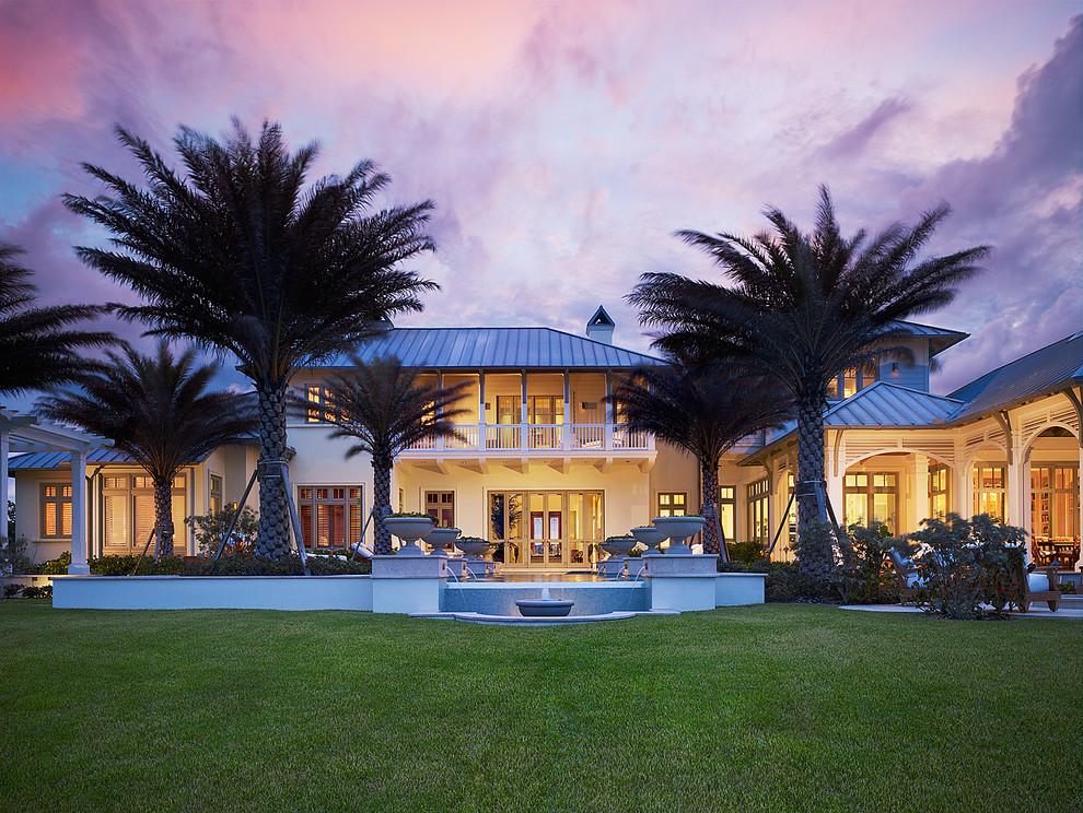 This is an example of a tropical two-storey white exterior in Miami.