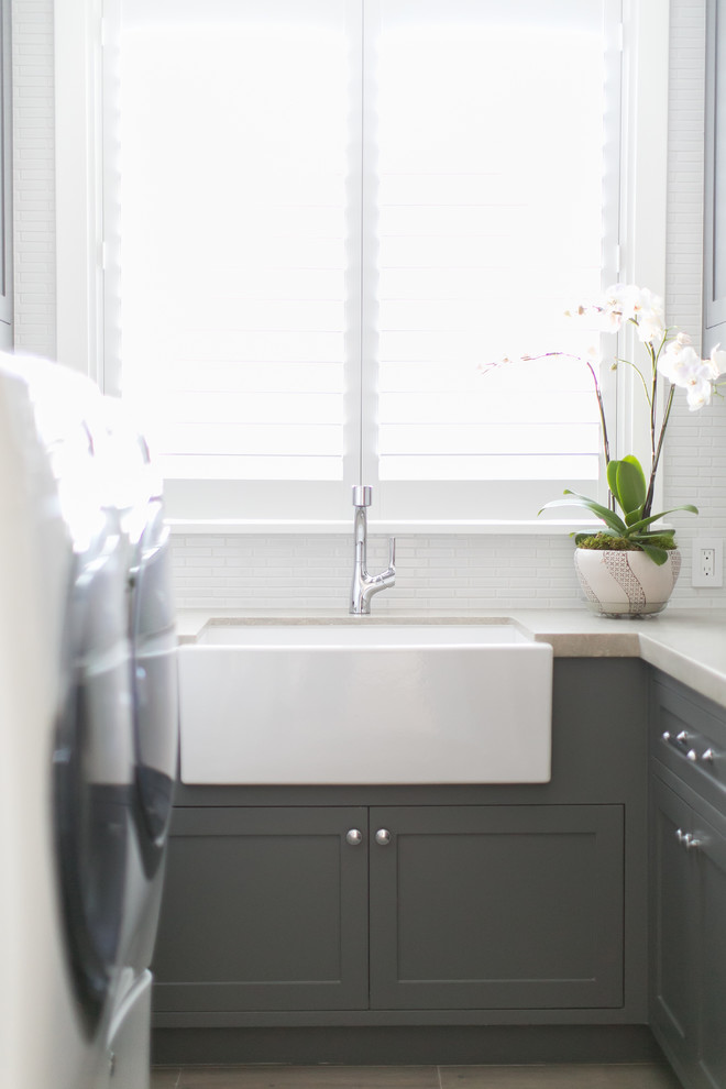 Example of a transitional laundry room design in Orange County