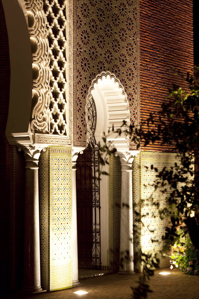 Tuscan home design photo in Miami